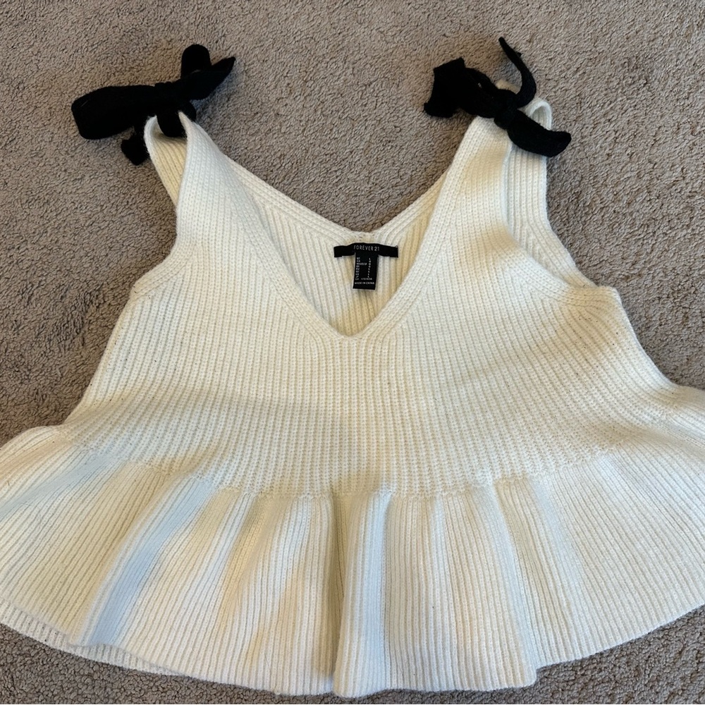 Chic White Knit Sleeveless Top with Black Bows